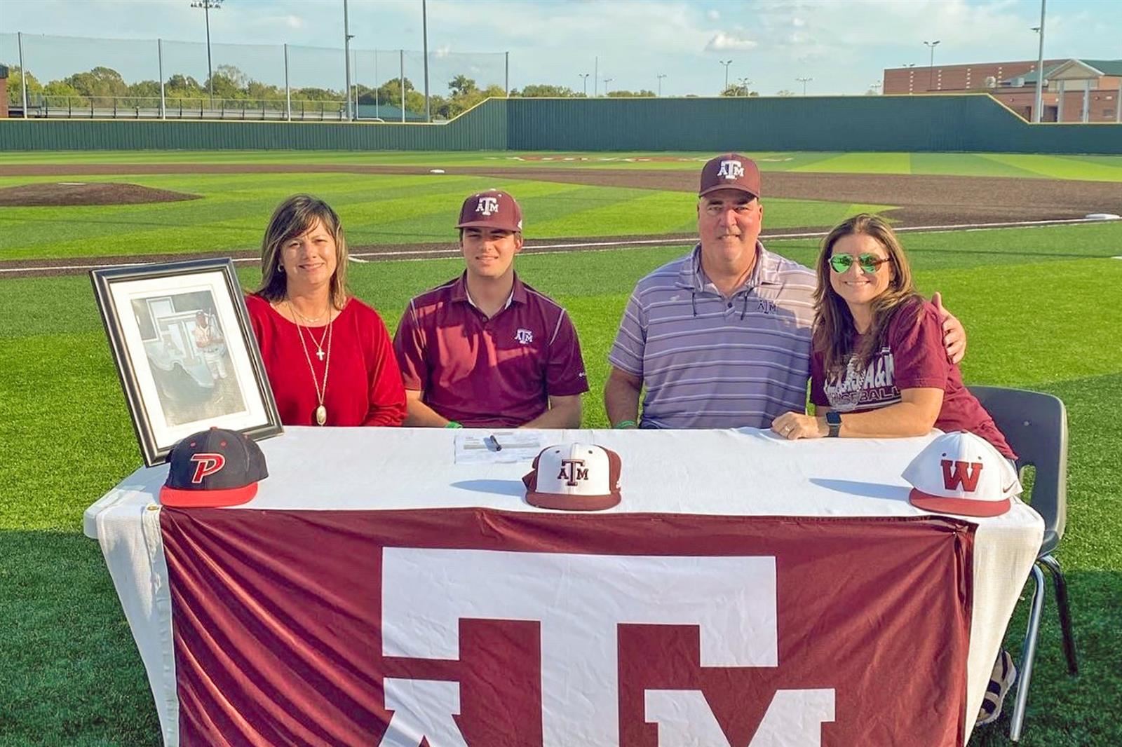 Cypress Woods High School senior Brady Sullivan, second from left, signed a letter of intent to play baseball at Texas A&M.